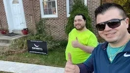 FEATHERFALL team member with happy homeowner after completed project